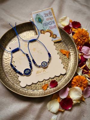 set of 2 blue evil eye thread rakhi with roli chawal chandan mishri 3