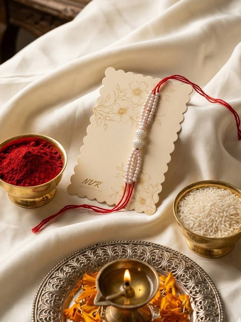 white pearls & red thread rakhi with roli chawal chandan mishri