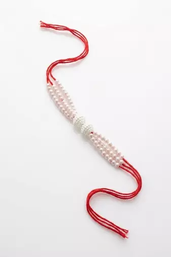 white pearls & red thread rakhi with roli chawal chandan mishri