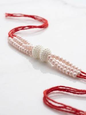 white pearls & red thread rakhi with roli chawal chandan mishri 4