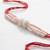 white pearls & red thread rakhi with roli chawal chandan mishri
