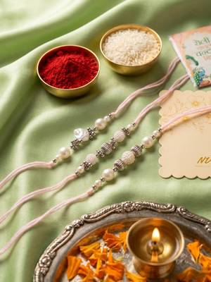 set of 3 white pearls thread rakhi with roli chawal chandan mishri 2