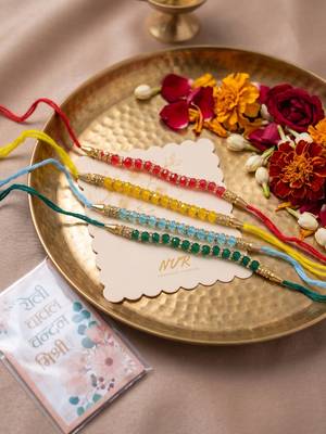 set of 4 multicolor artificial beads thread rakhi with roli chawal chandan mishri 2