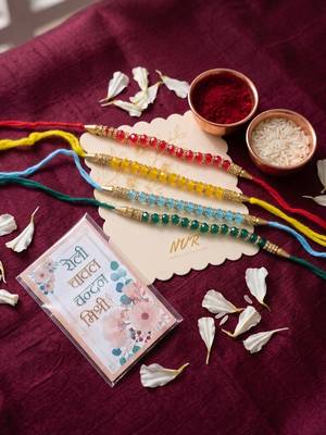 set of 4 multicolor artificial beads thread rakhi with roli chawal chandan mishri 4