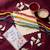 set of 4 multicolor artificial beads thread rakhi with roli chawal chandan mishri