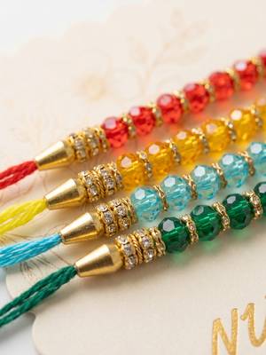 set of 4 multicolor artificial beads thread rakhi with roli chawal chandan mishri 5