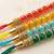 set of 4 multicolor artificial beads thread rakhi with roli chawal chandan mishri