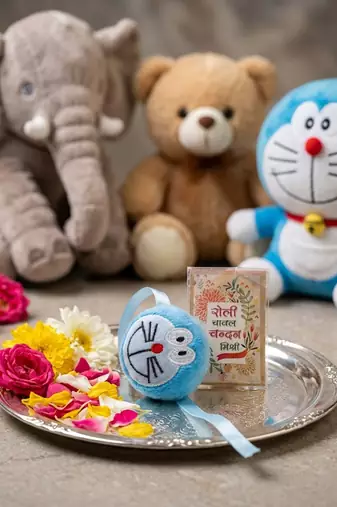 kids doremon design thread rakhi with roli chawal chandan mishri