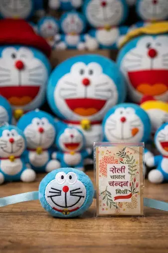 kids doremon design thread rakhi with roli chawal chandan mishri