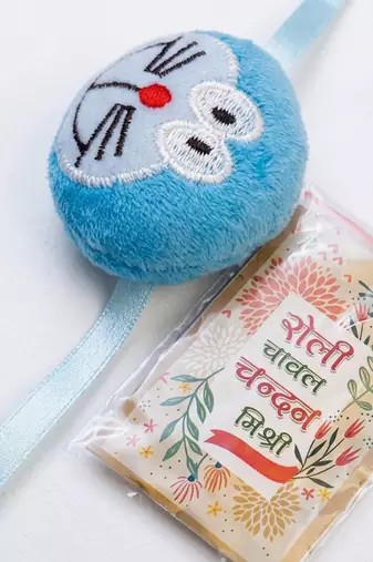 kids doremon design thread rakhi with roli chawal chandan mishri