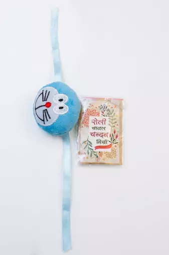kids doremon design thread rakhi with roli chawal chandan mishri