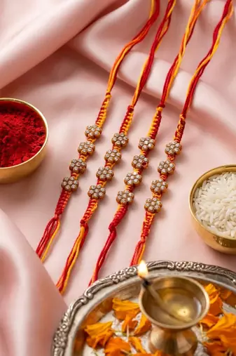 set of 4 artificial stones floral design thread rakhi with roli chawal chandan mishri