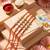set of 4 artificial stones floral design thread rakhi with roli chawal chandan mishri