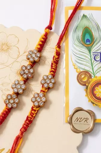 set of 4 artificial stones floral design thread rakhi with roli chawal chandan mishri