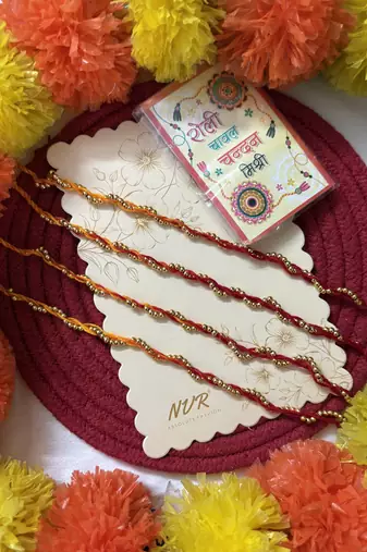 set of 4 yellow & red thread rakhi with roli chawal chandan mishri