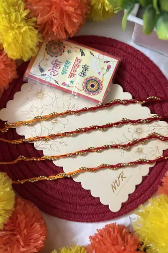 set of 4 yellow & red thread rakhi with roli chawal chandan mishri