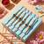 set of 6 rudraksh & artificial beads thread rakhi with roli chawal chandan mishri