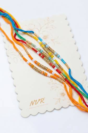 set of 6 multi artificial beads thread rakhi with roli chawal chandan mishri