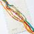 set of 6 multi artificial beads thread rakhi with roli chawal chandan mishri