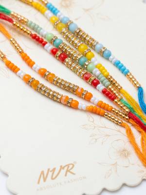 set of 6 multi artificial beads thread rakhi with roli chawal chandan mishri 2