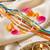 set of 6 multi artificial beads thread rakhi with roli chawal chandan mishri