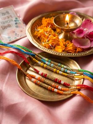 set of 6 multi artificial beads thread rakhi with roli chawal chandan mishri 5