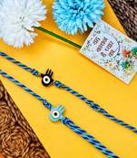 set of 2 evil eye & blue thread rakhi with roli chawal chandan mishri