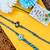 set of 2 evil eye & blue thread rakhi with roli chawal chandan mishri