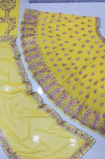 yellow georgette lehenga choli with embroidery and fancy dupatta