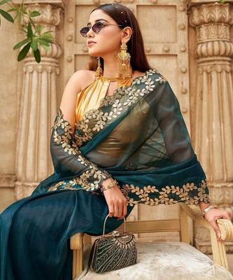 Teal net solid saree with blouse 4