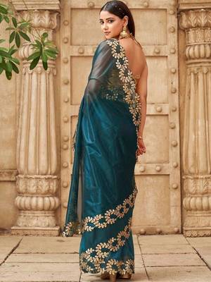 Teal net solid saree with blouse 5