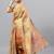 Beige tissue printed saree with blouse
