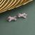 Silver plated pink bow stud earrings