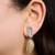 Dual tone statement drop earrings