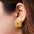 Gold plated yellow stone stud earrings