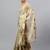 Beige tissue printed saree with blouse