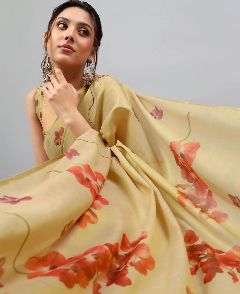 Cream tissue printed saree with blouse
