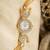 gold  color women gold-toned kashmiri pearl & stone-studded ethnic wrist watch