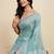 Turquoise linen printed saree with blouse