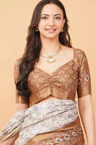 Off white polyester printed saree with blouse