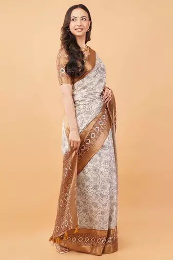 Off white polyester printed saree with blouse