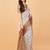 Off white polyester printed saree with blouse
