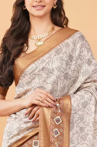 Off white polyester printed saree with blouse