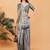 Grey polyester woven design saree with blouse