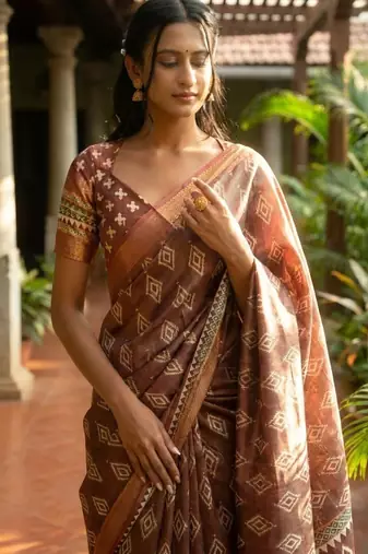 Brown polyester woven design saree with blouse