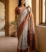 Off white polyester printed saree with blouse