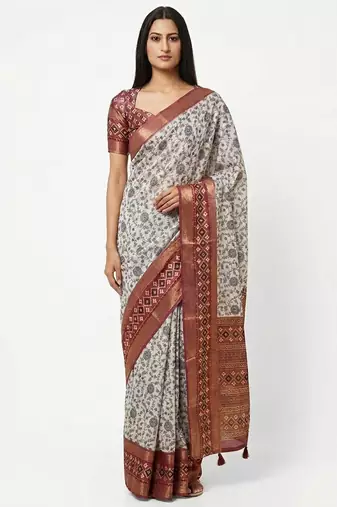 Off white polyester printed saree with blouse