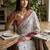 Off white polyester printed saree with blouse