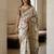 Off white polyester printed saree with blouse