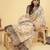 Off white polyester printed saree with blouse